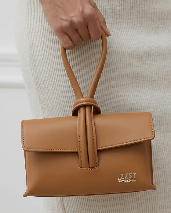 Knot Handle Flap Bag worn