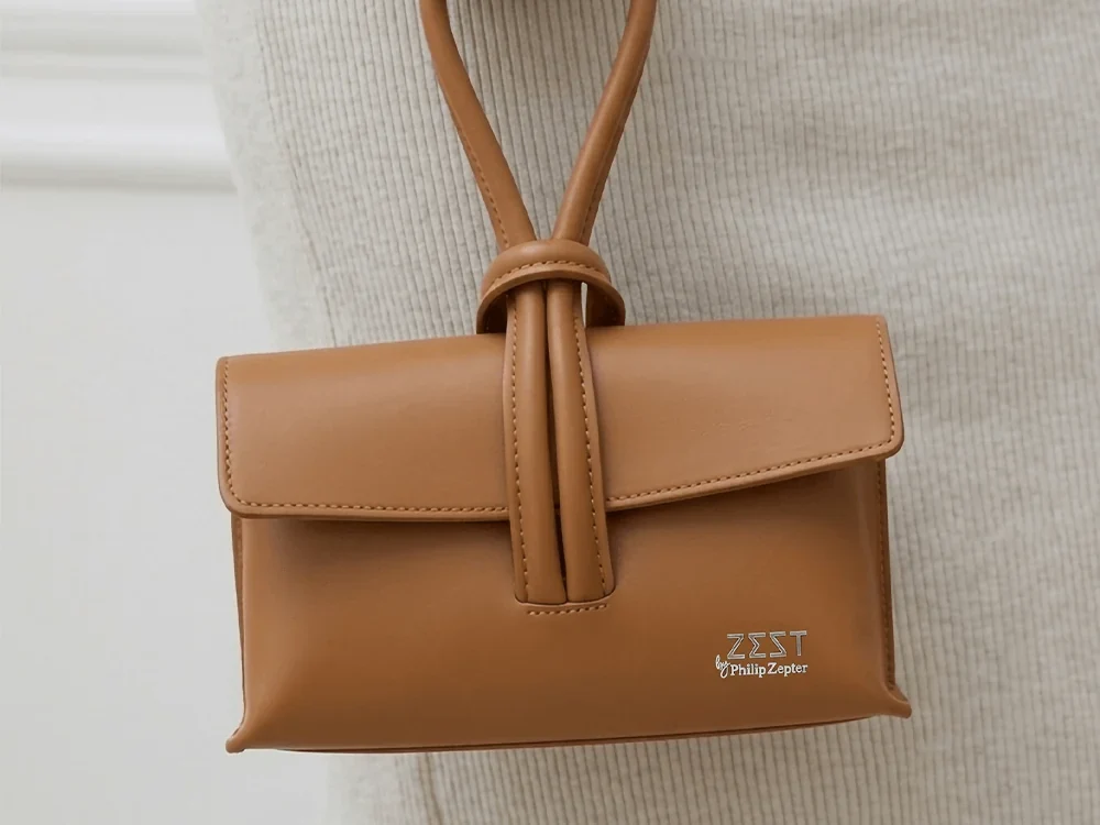 Knot Handle Flap Bag worn